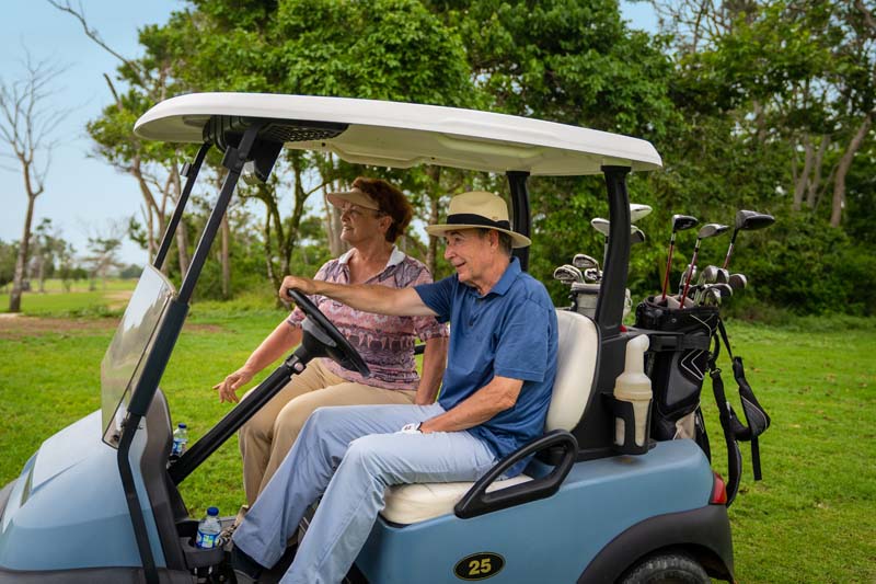 Couple in a Golf Cart at Karibana Cartagena