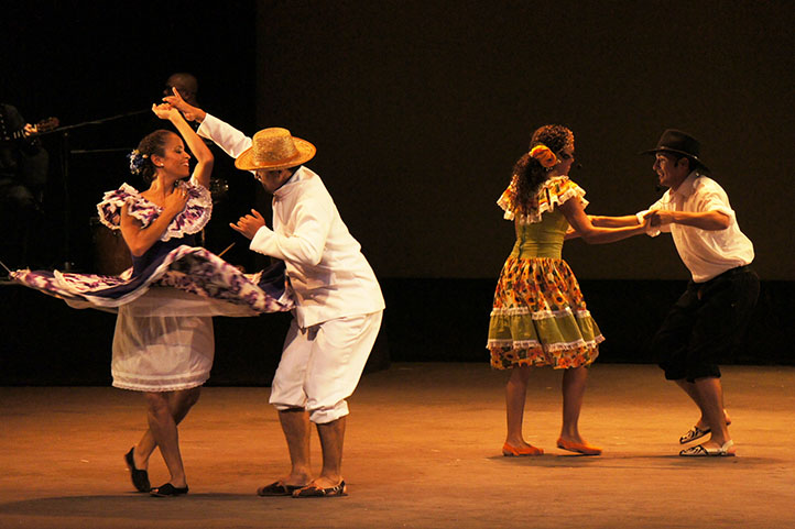 Two couples dancing joropo in the stage