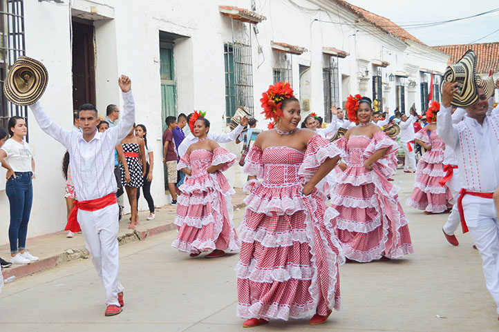 Ladies dancing cumbia in the street