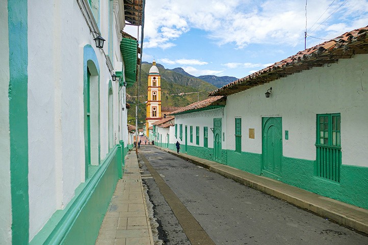 Colonial street of green houses in El Cocuy Boyacá Colombia