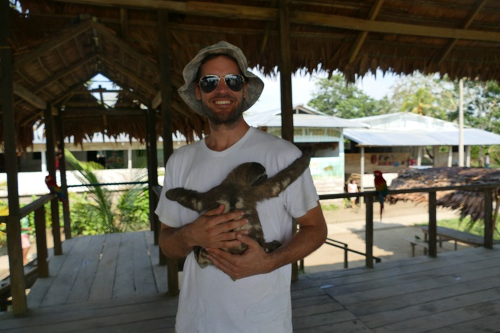 Sloth and tourist in Amazonas Colombia